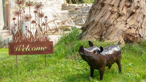 Recycled metal pig in a garden